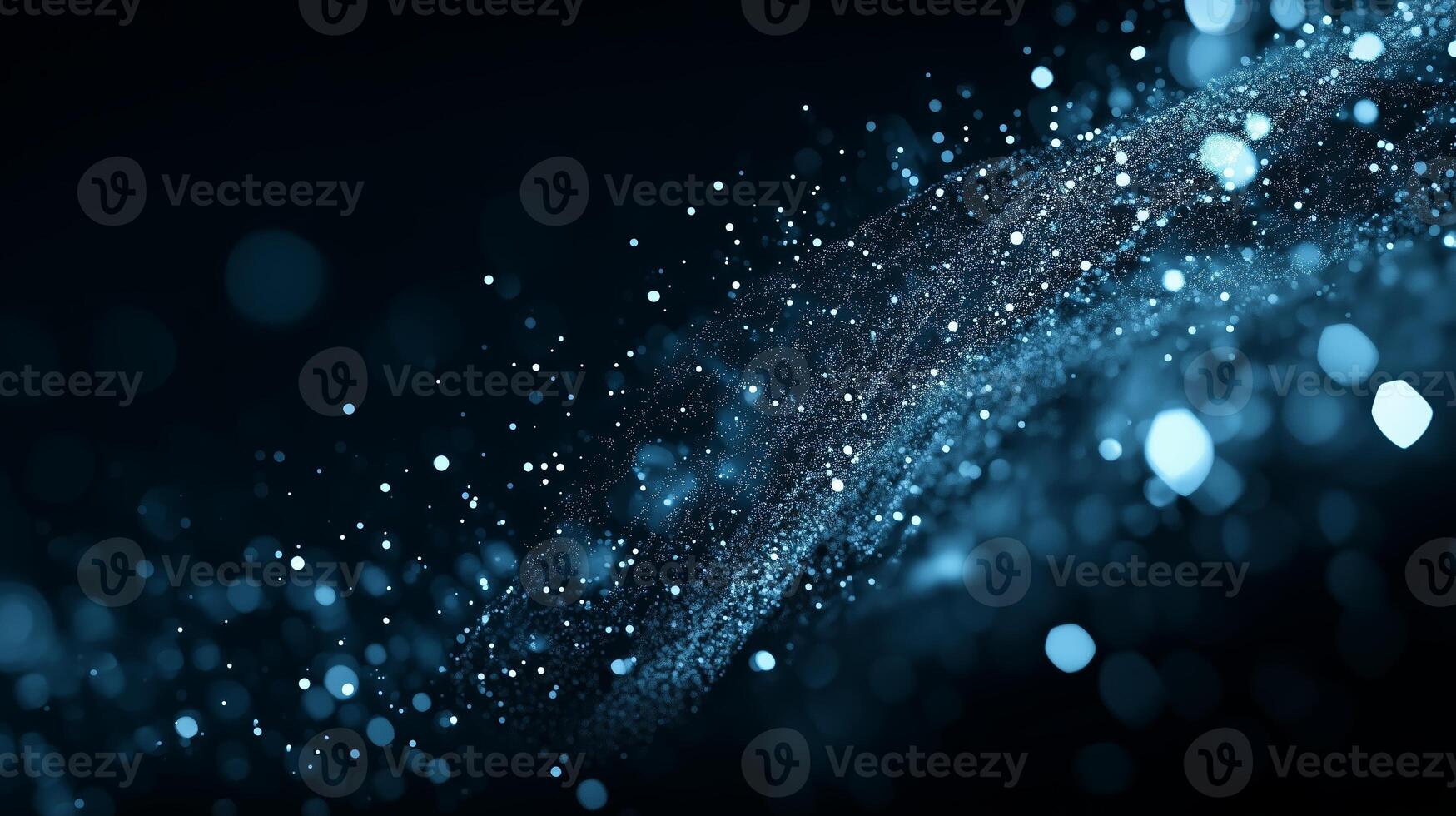 Vibrant blue particles create a mesmerizing wave effect against a dark background photo