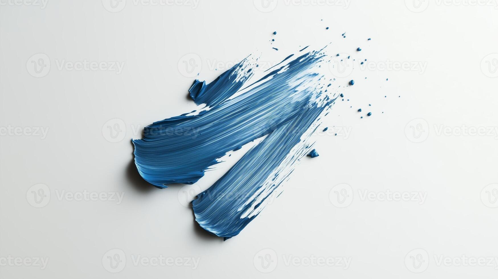 Bold blue paint stroke across a white canvas creates an artistic splash illustrating creativity and color dynamics photo