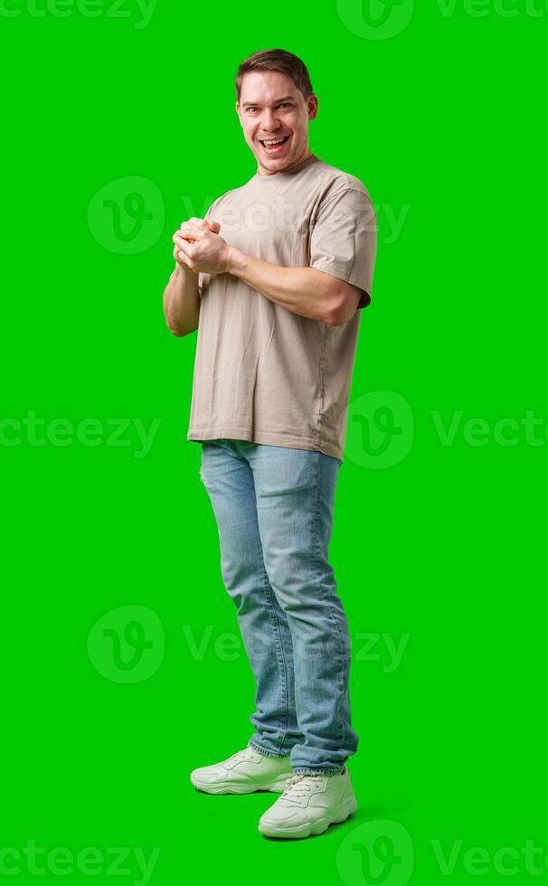 A cheerful man with a friendly smile poses against a bright green background photo