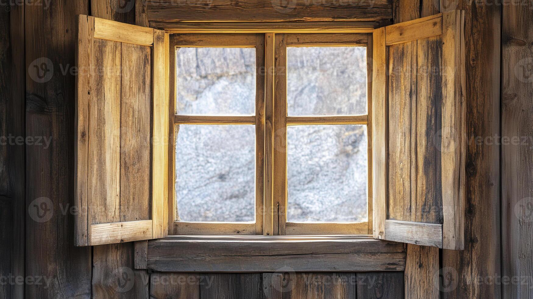Sunlight streaming through a rustic wooden window in a cabin, creating a warm atmosphere against a rocky landscape photo