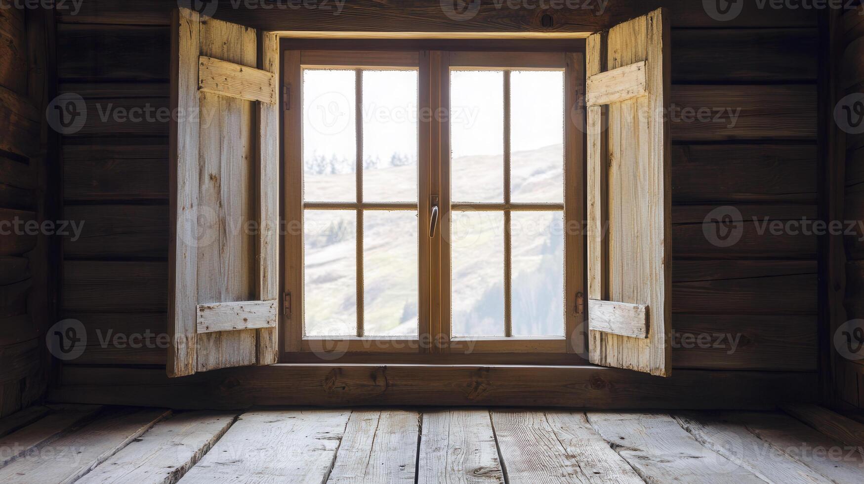 A wooden window with open shutters overlooking a serene landscape during daylight photo
