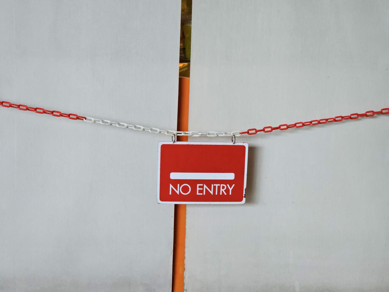 Red board no entry sign in the area where unauthorized access is prohibited. photo