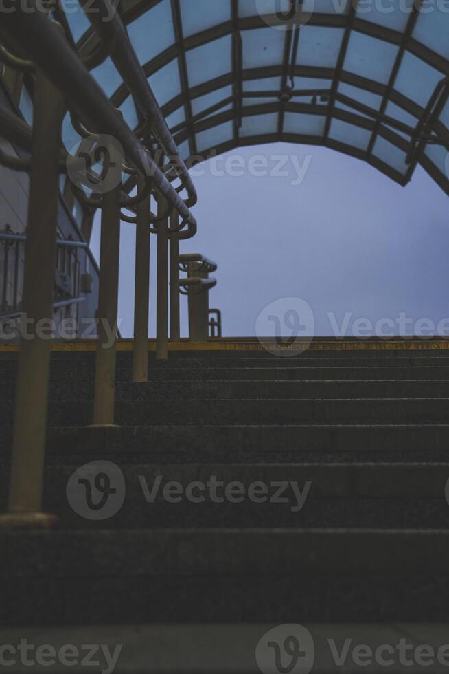 Exit from the underpass in the evening. Cloudy sky. Steps up photo
