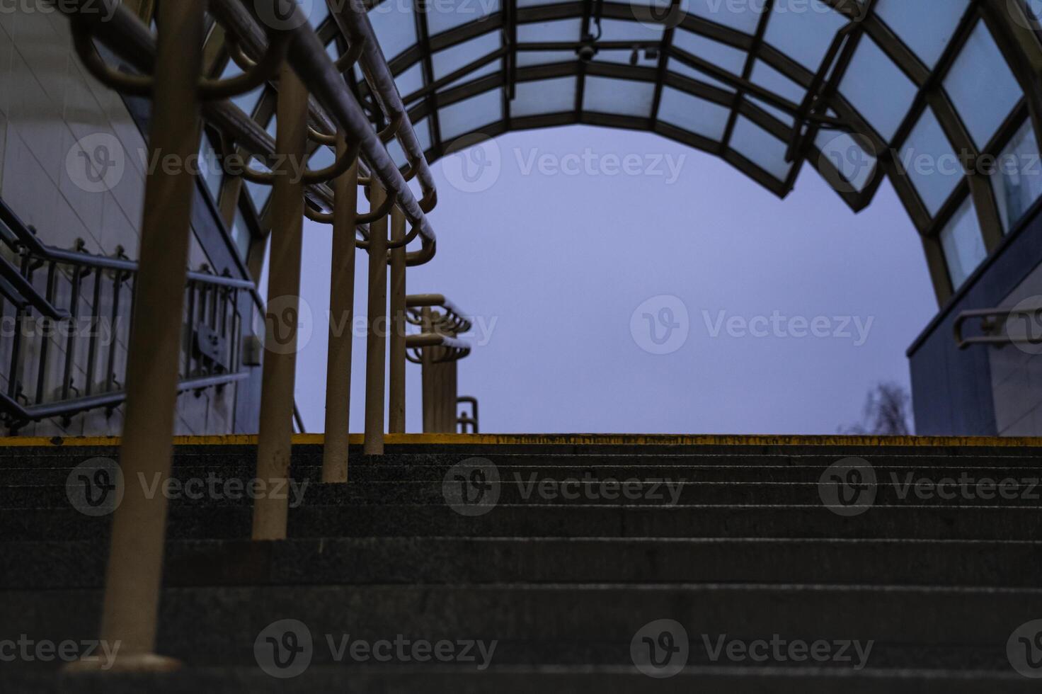 Exit from the underpass in the evening. Cloudy sky. Steps up photo