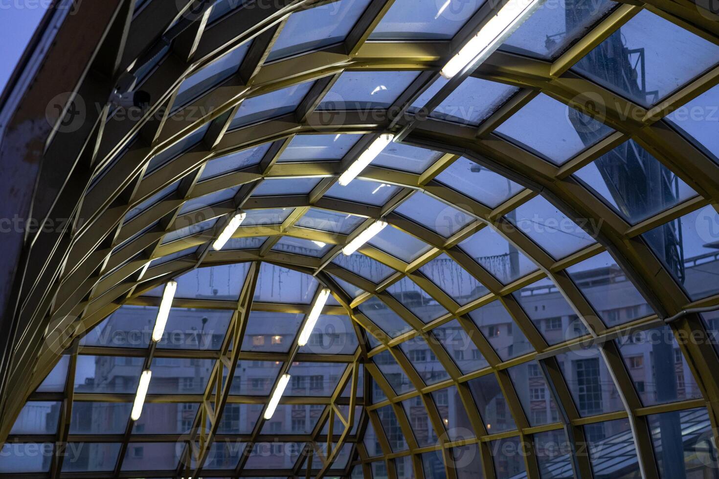 The underpass is illuminated in the evening photo