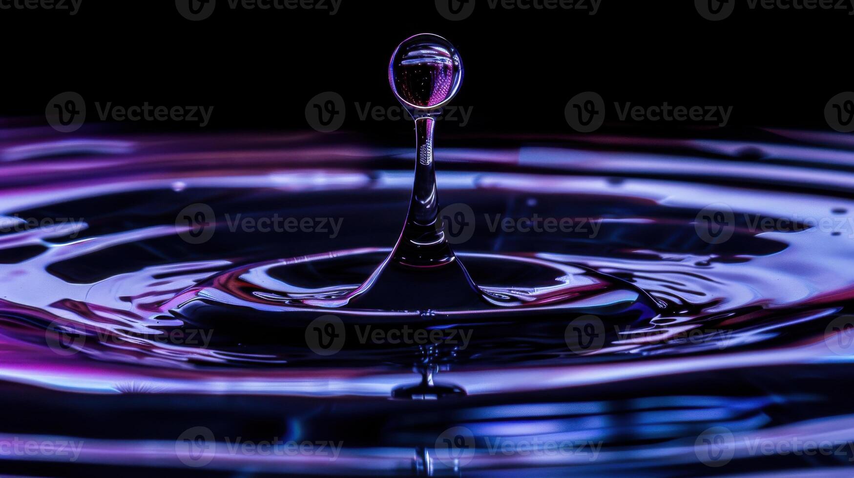 Water drop in dark deep blue purple color. Calming and meditation background. photo