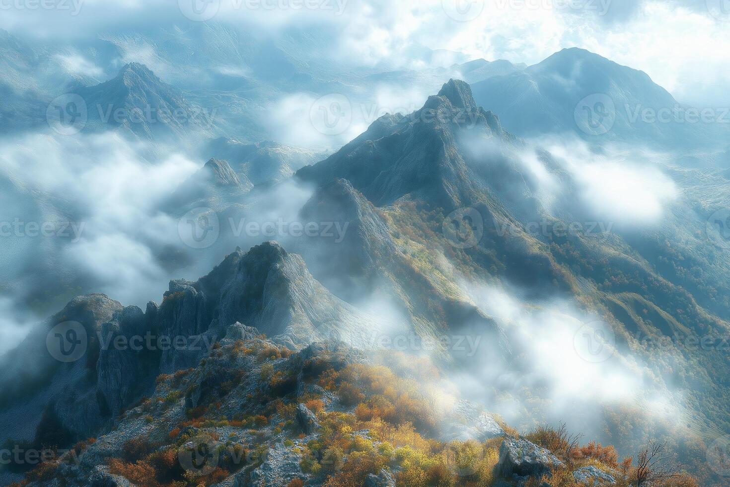 Fog rolling over majestic mountain peaks in autumn photo