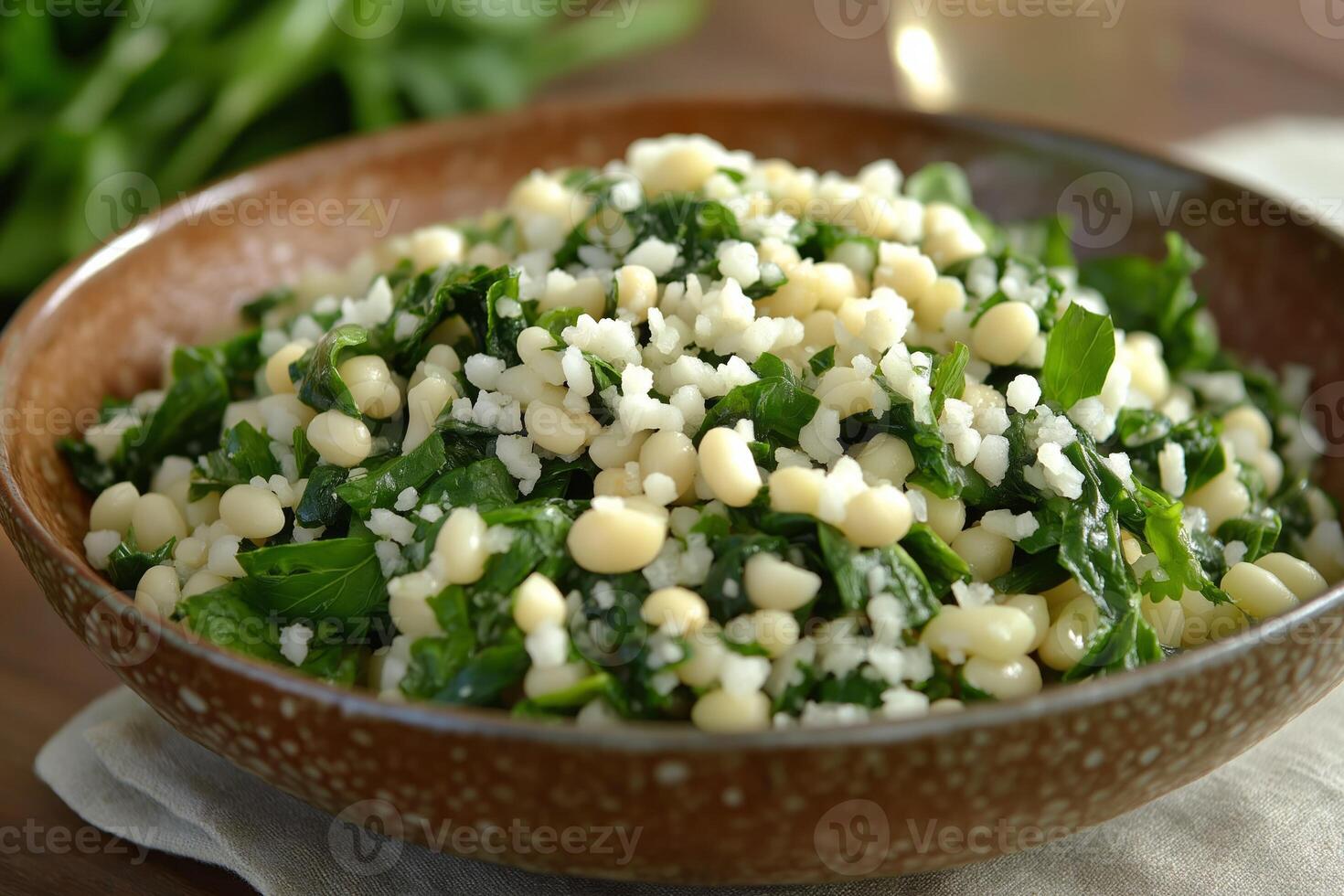 Spinach, beans, and crumbled cheese creating a healthy and delicious meal photo