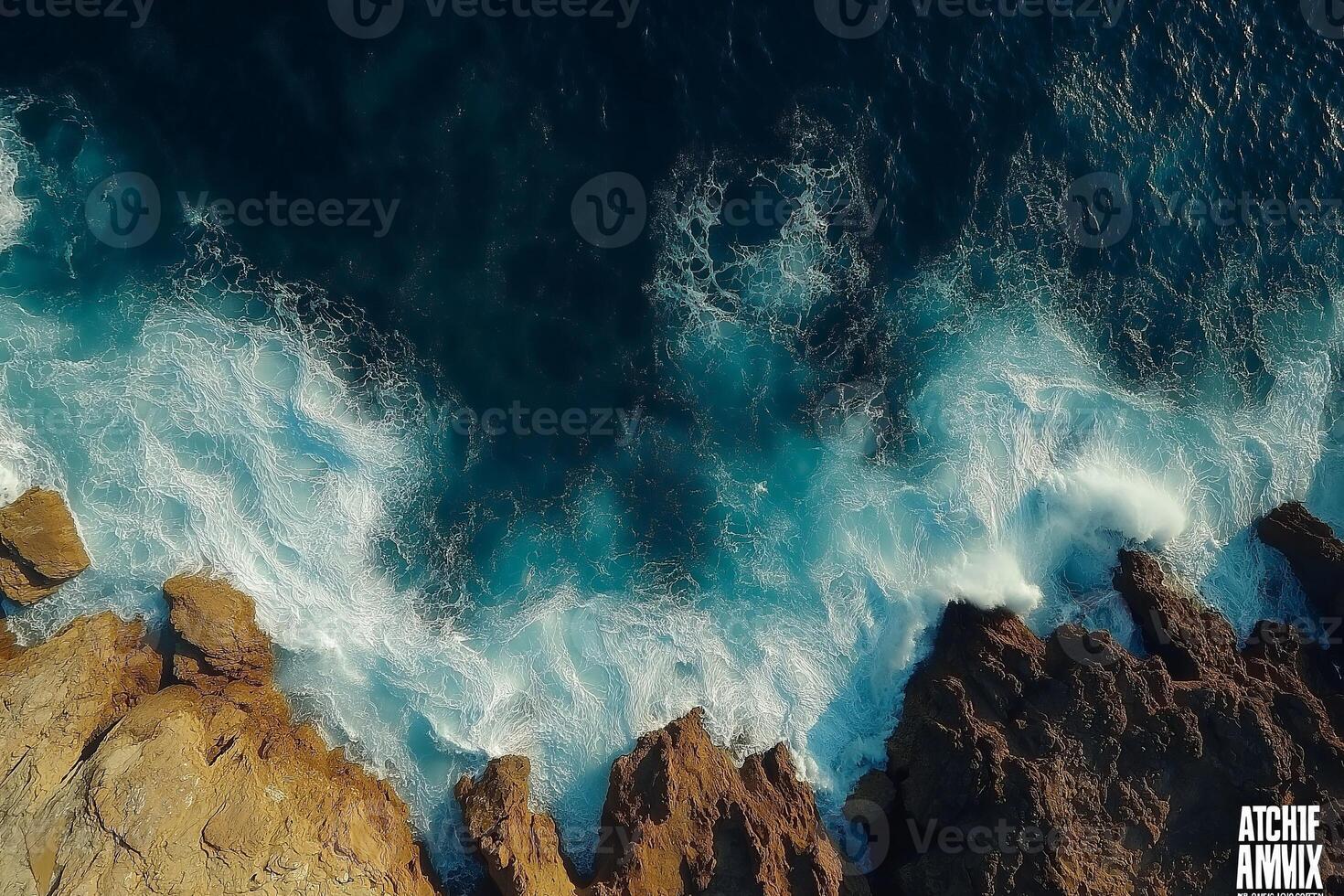 Ocean waves crashing on rocky coastline aerial view of turquoise water and rugged cliffs photo
