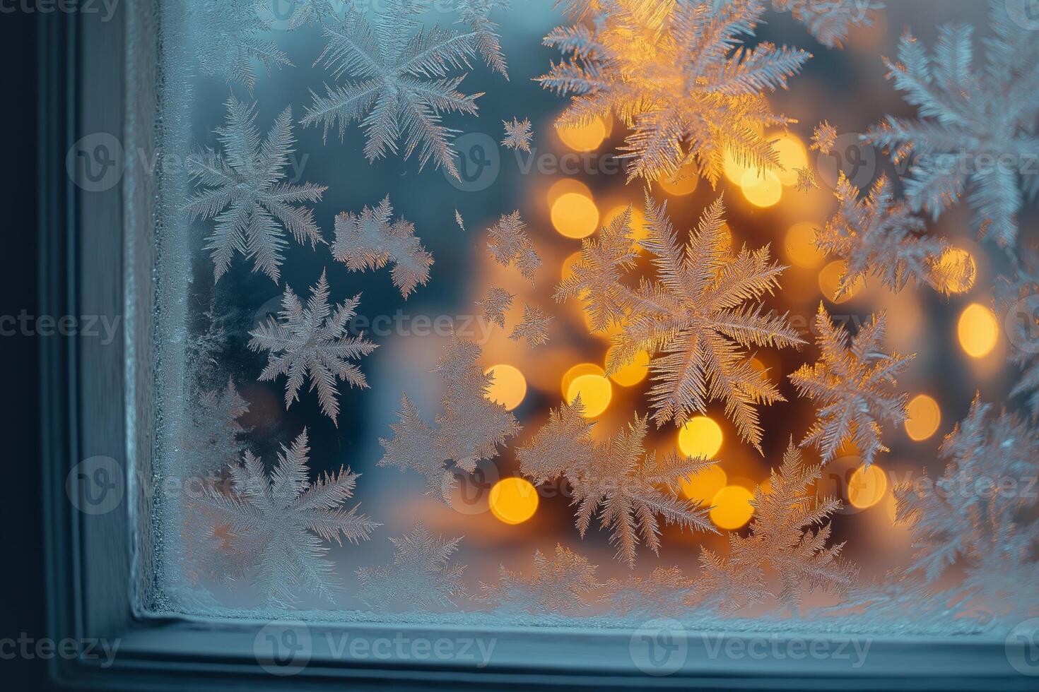 Frost covering window with christmas tree lights in background photo