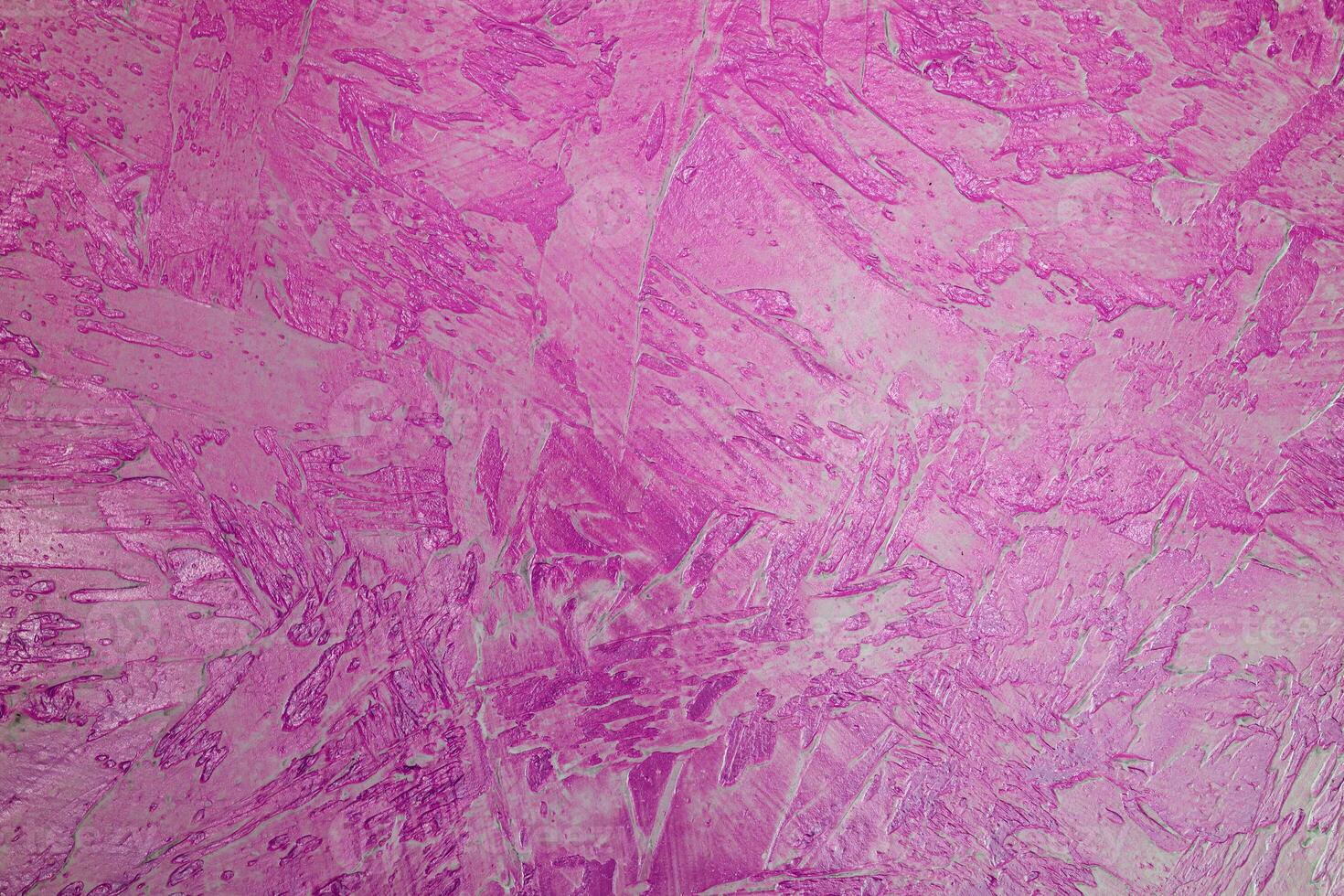 Texture of pink plaster. Rough wall of the building. photo