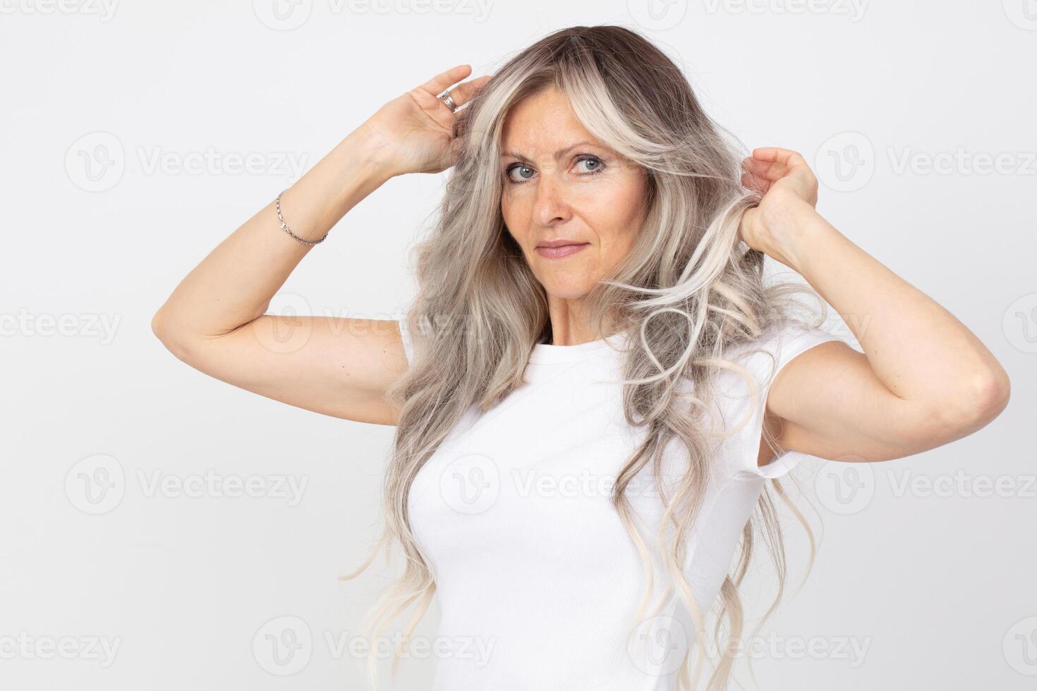 An elderly woman with gray hair is beautiful and happy. photo