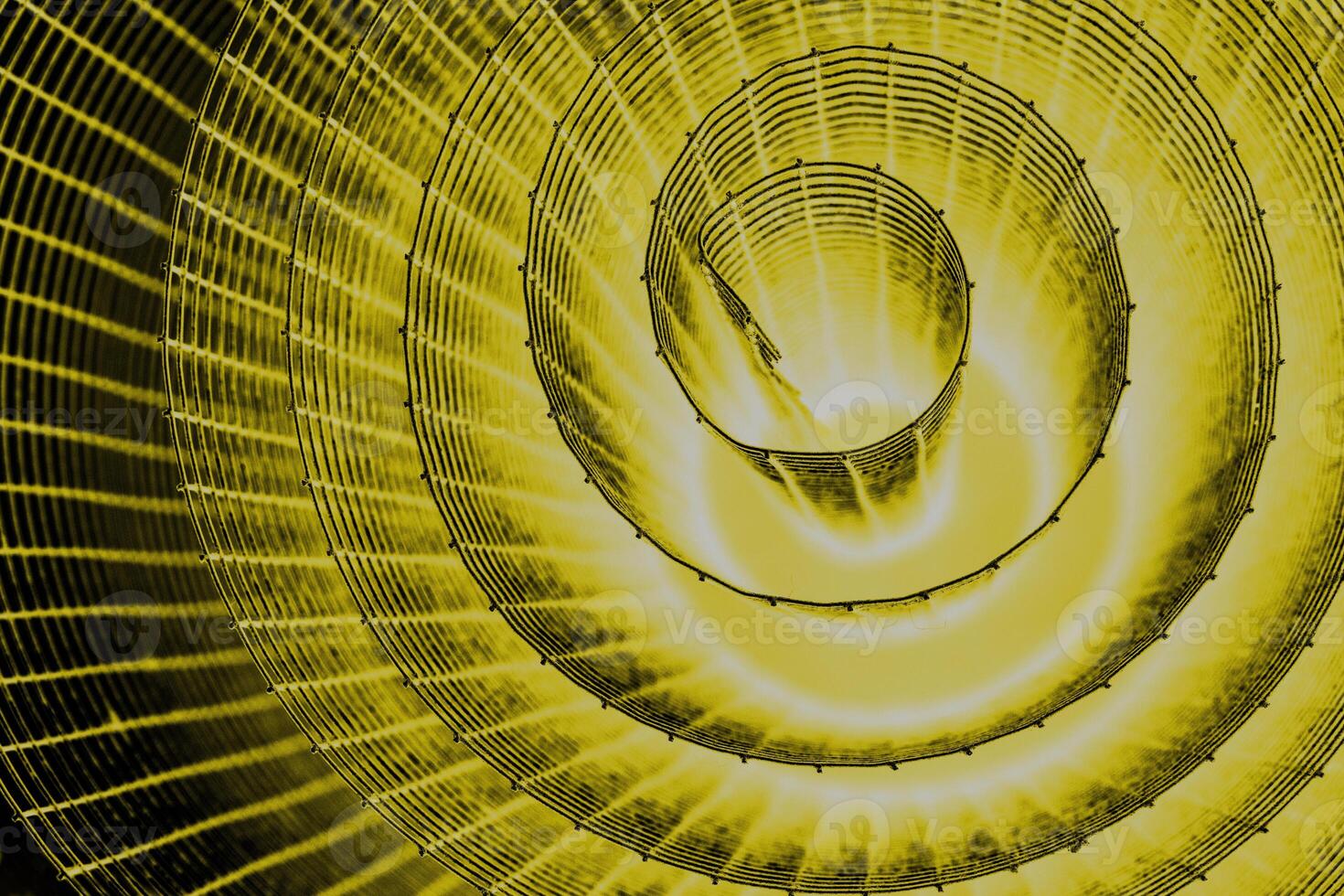 Abstract spiral with glowing yellow wire texture against a black background, symbolizing color contrast, energy, motion, industrial and futuristic design concepts. Copy space photo