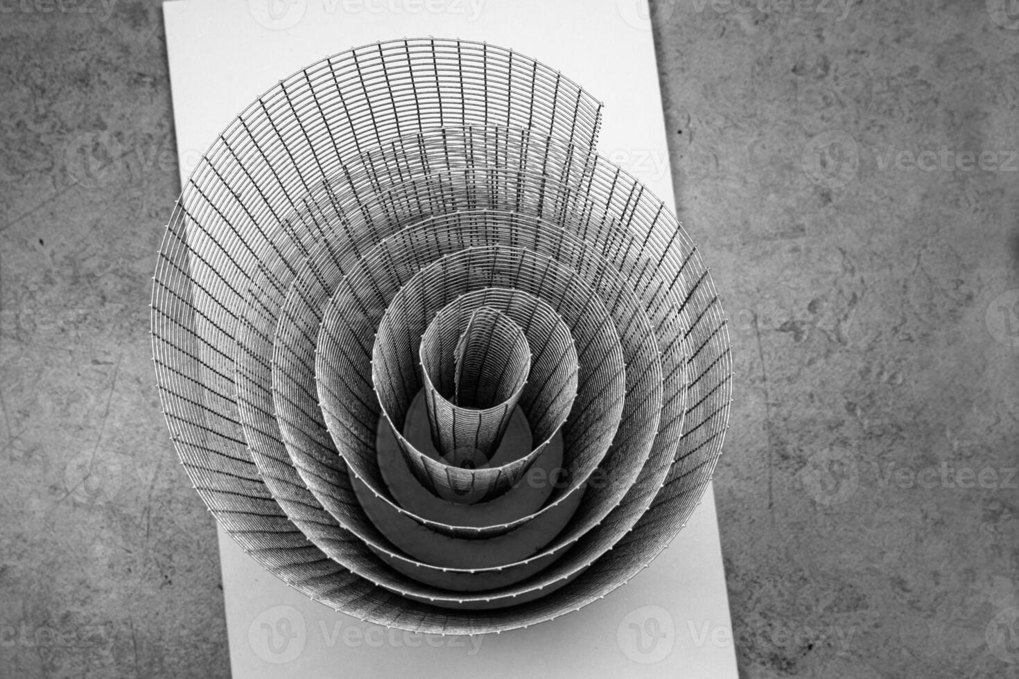 Abstract artistic geometric spiral wire mesh with detailed curves and shadows, suitable for abstract backgrounds, geometric design, and creative photography projects. Copy space photo