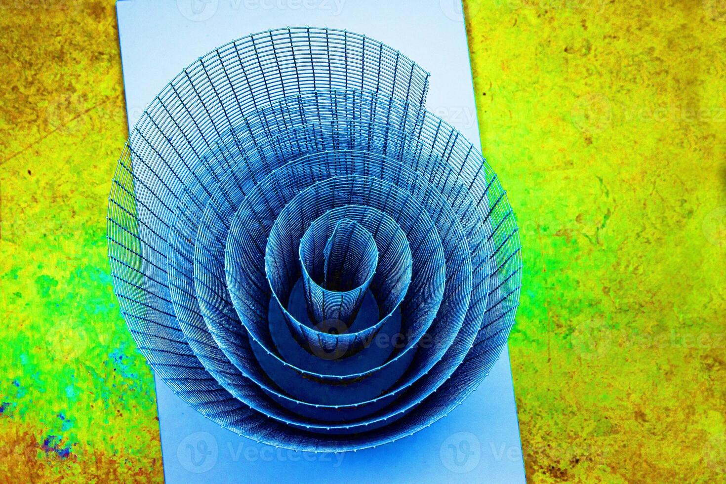 Abstract spiral structure with blue, green and yellow tones, dynamic composition, vibrant textures, modern design, colorful geometric futuristic pattern, creative inspiration, and visual art. photo