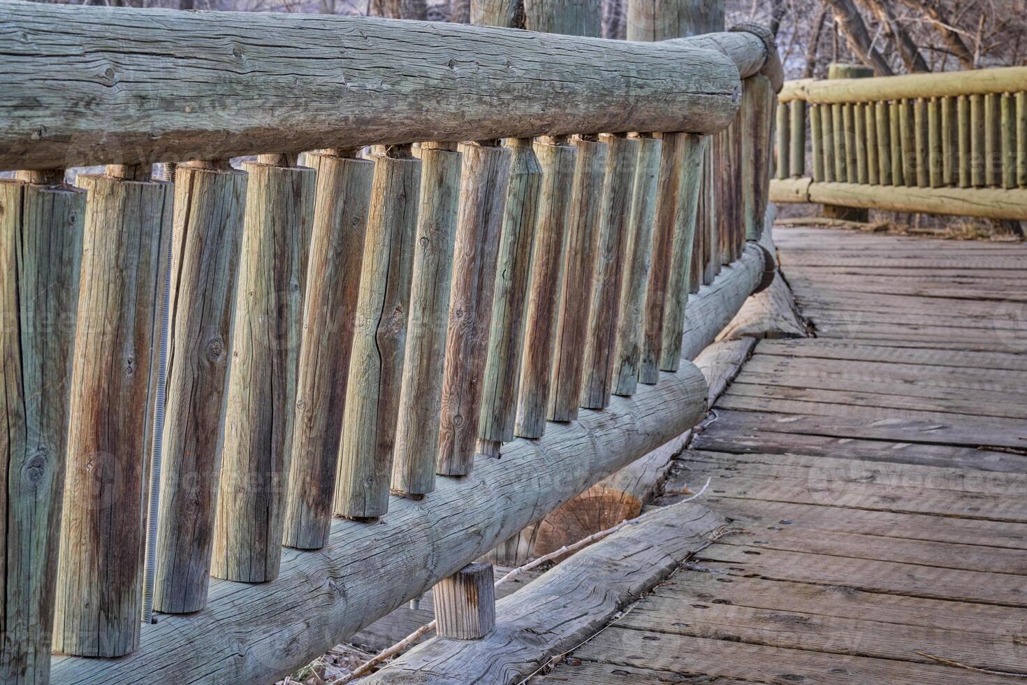 wooden boardwalk in natural area photo