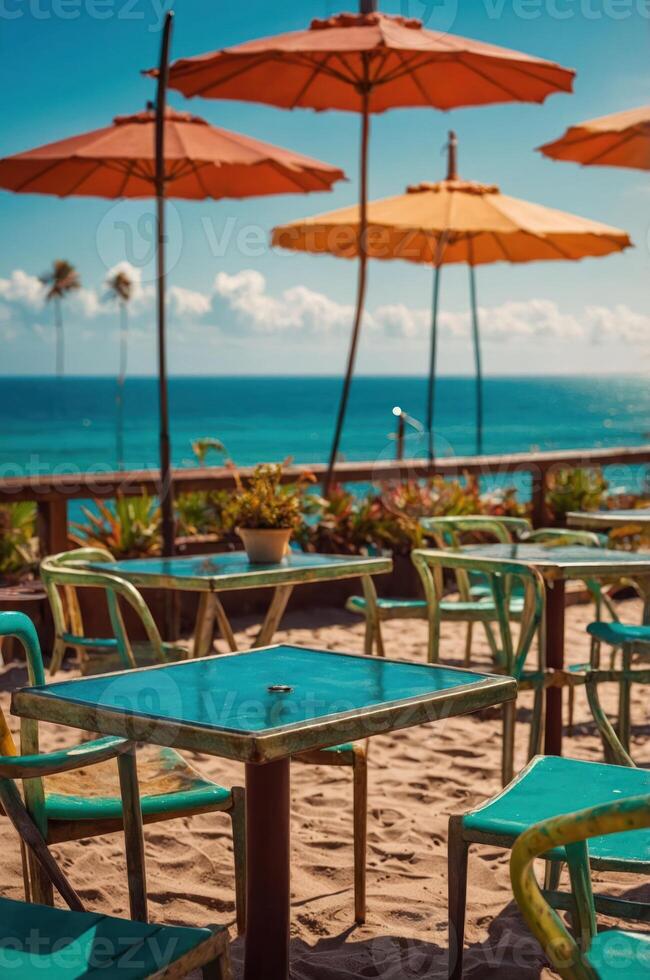Beachside caf with colorful umbrellas and tables overlooking the ocean. photo