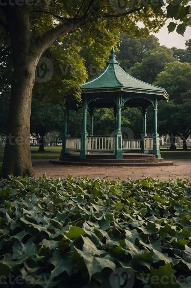 A decorative gazebo surrounded by lush greenery in a tranquil park setting. photo