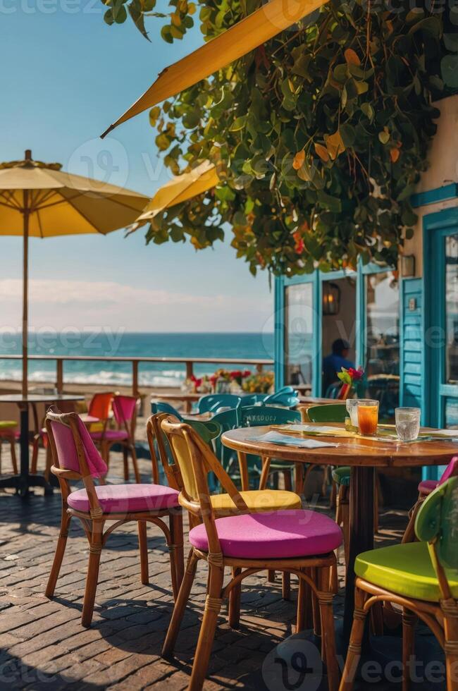A vibrant outdoor dining area by the beach with colorful chairs and umbrellas. photo