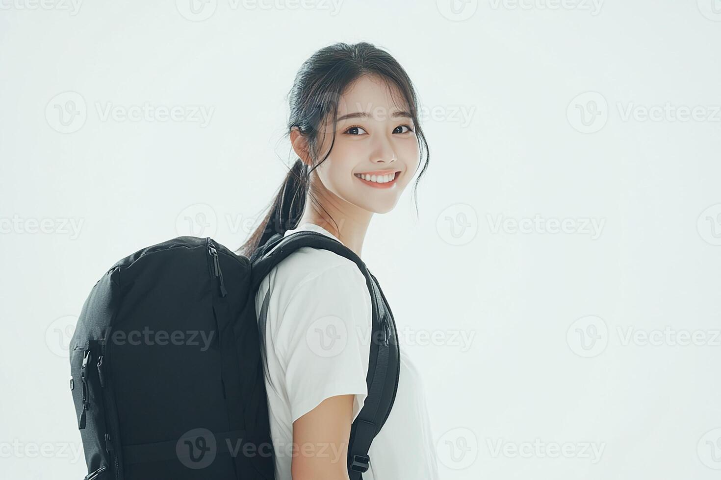 A woman with a backpack smiling photo