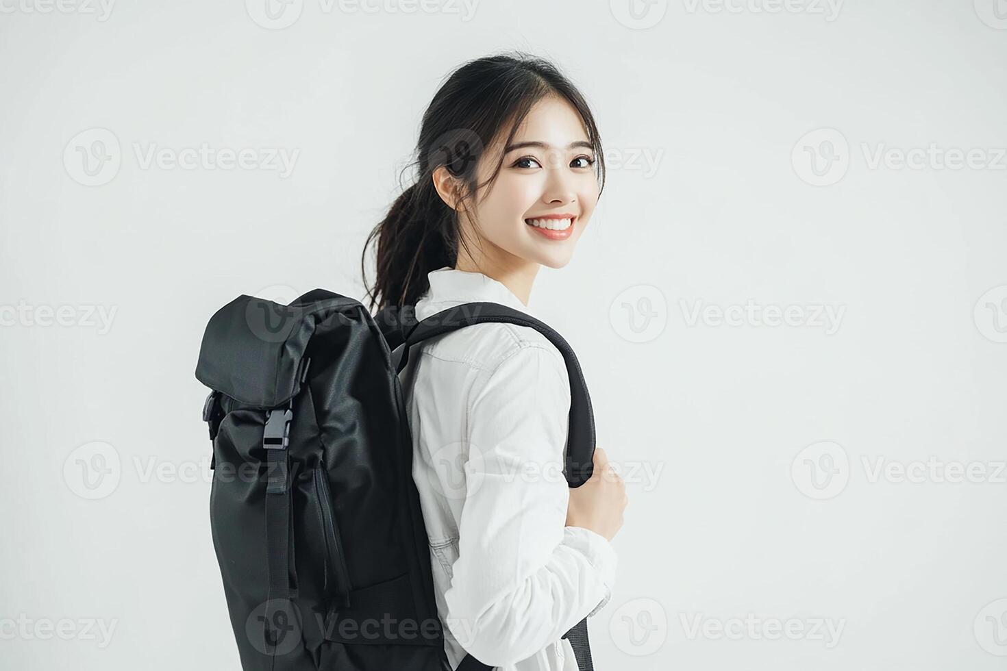 Portrait of asian woman with backpack on white background photo