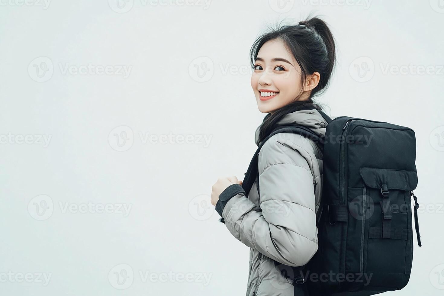 A woman with a backpack smiling photo