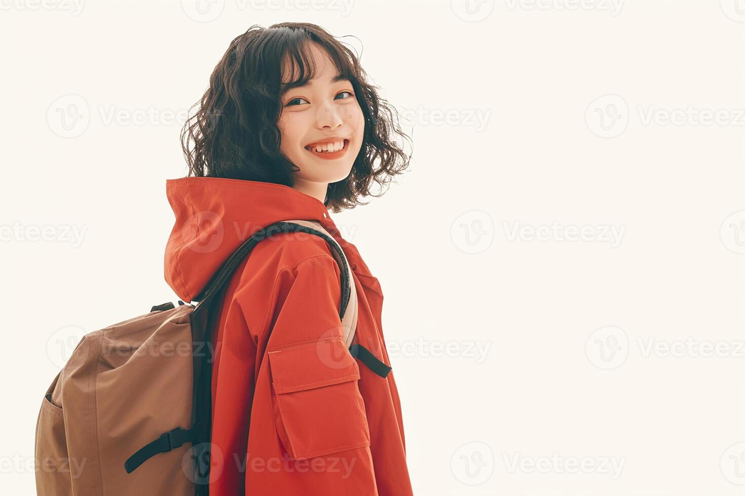 A woman with a backpack and red jacket photo