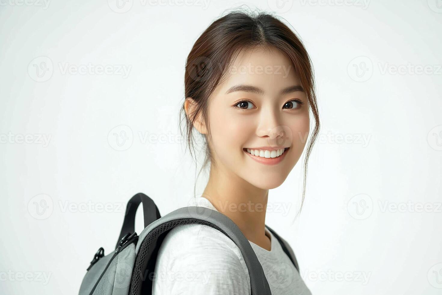 Asian woman with backpack smiling photo