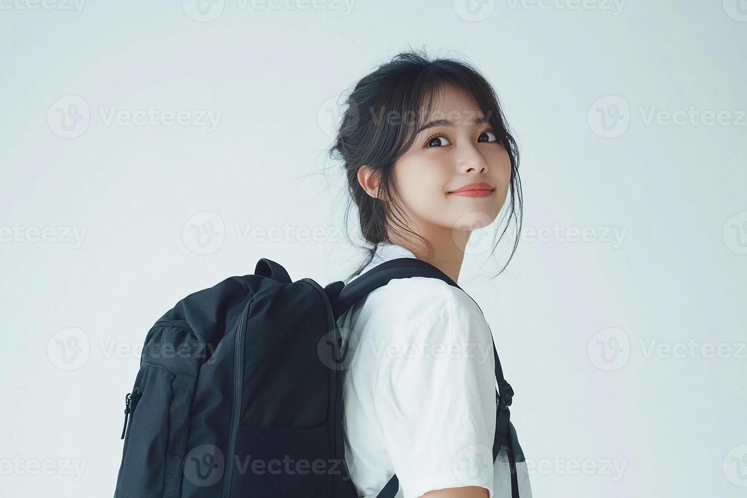 Asian woman with backpack on white background photo