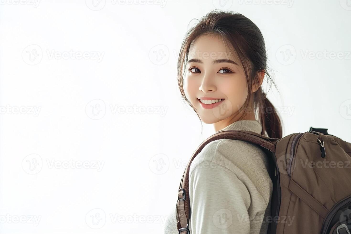A woman with a backpack smiling photo