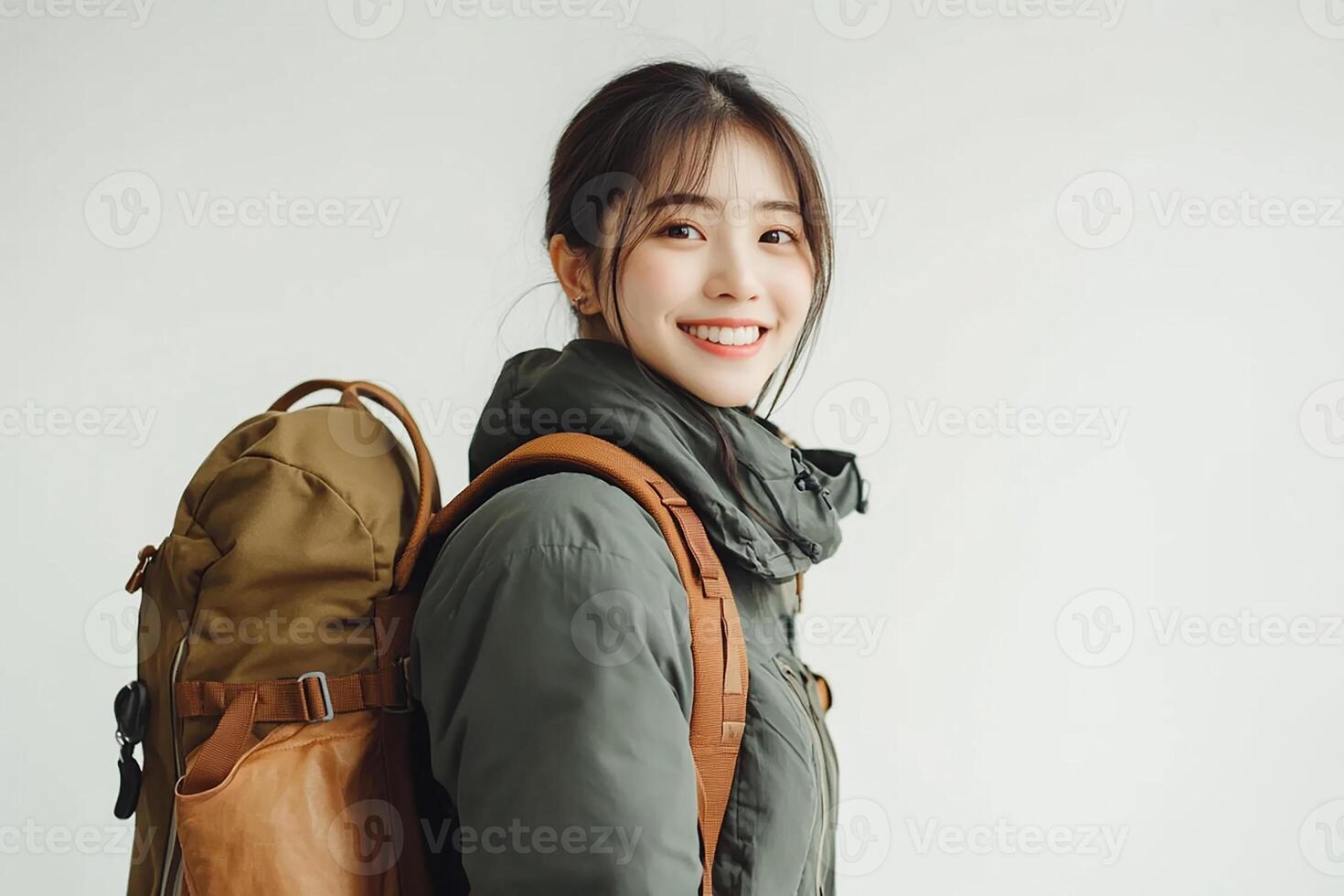A woman with a backpack smiling photo