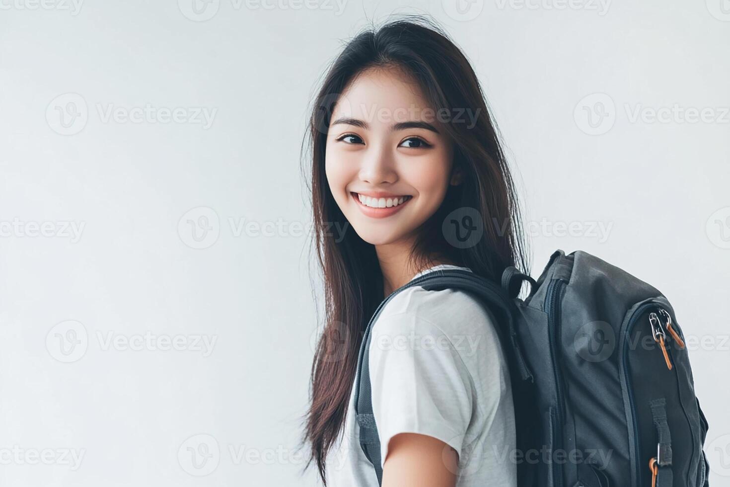 Asian woman with backpack smiling photo