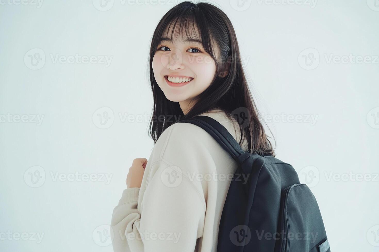 A woman with a backpack smiling photo