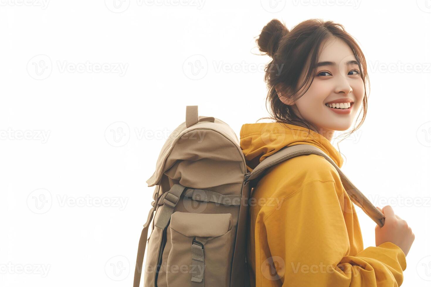 A woman in yellow jacket with a backpack photo