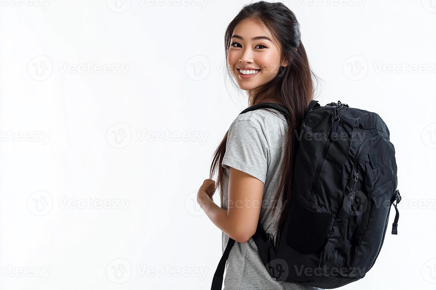 A young woman with a backpack smiling photo