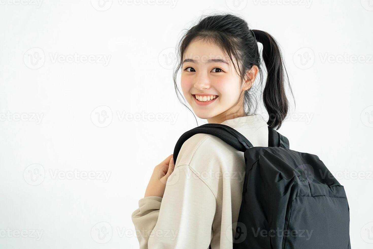 Asian woman with backpack smiling photo