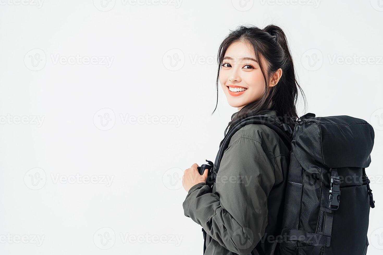 Portrait of young asian woman with backpack isolated on white background photo