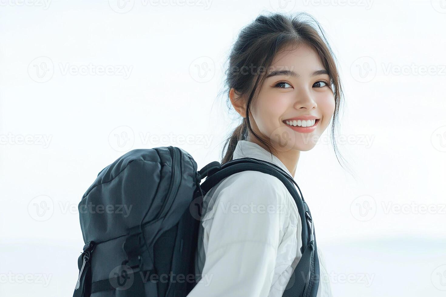 Asian woman with backpack smiling photo