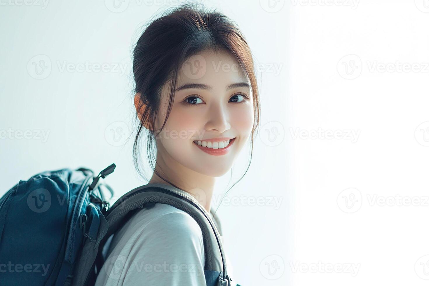 A woman with a backpack smiling photo