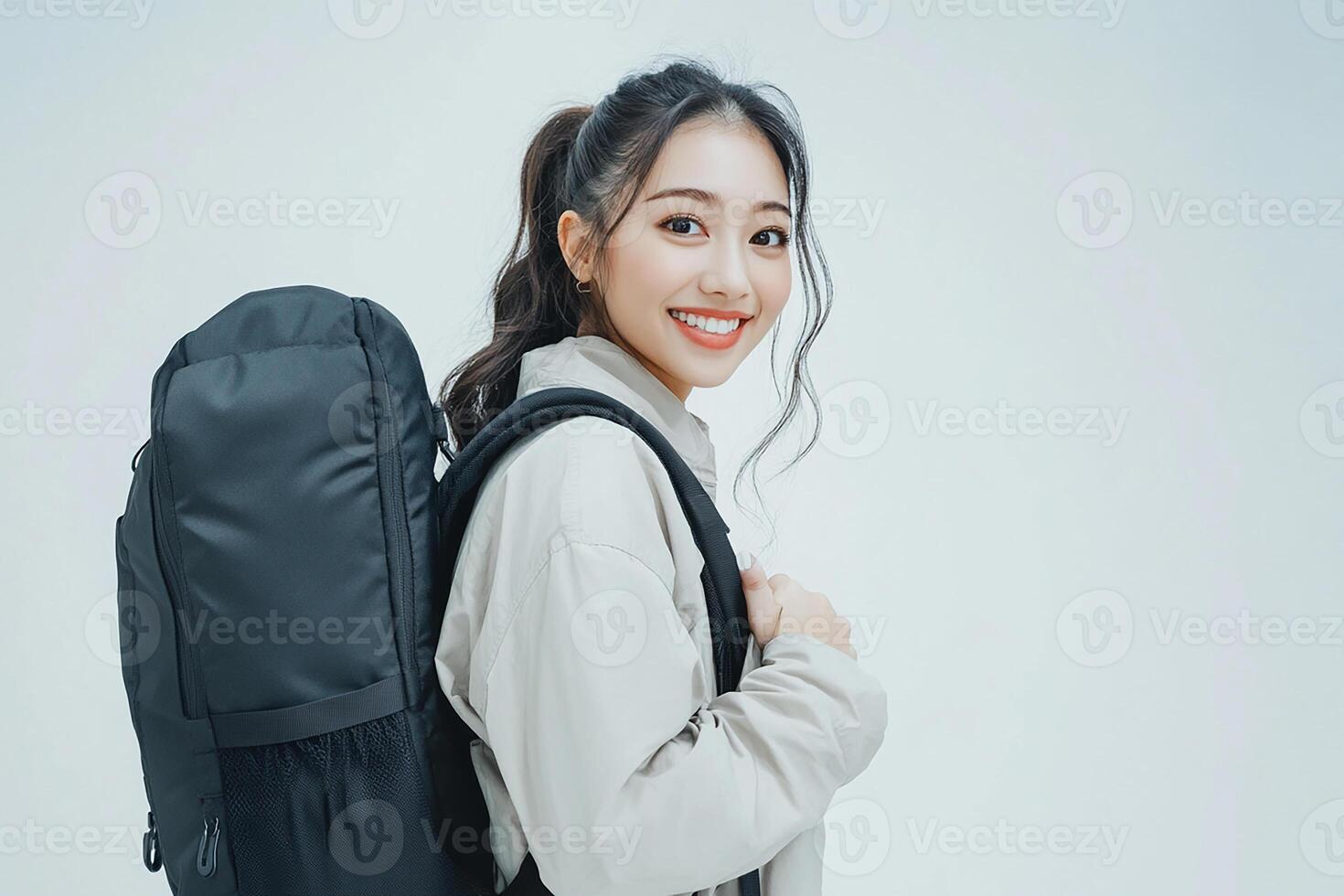 A woman with a backpack smiling photo