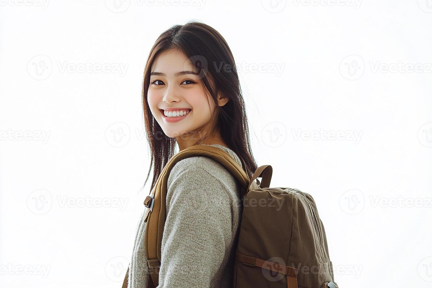 A young woman with a backpack smiling photo