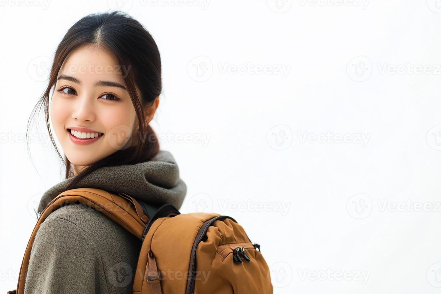 Asian woman with backpack smiling photo