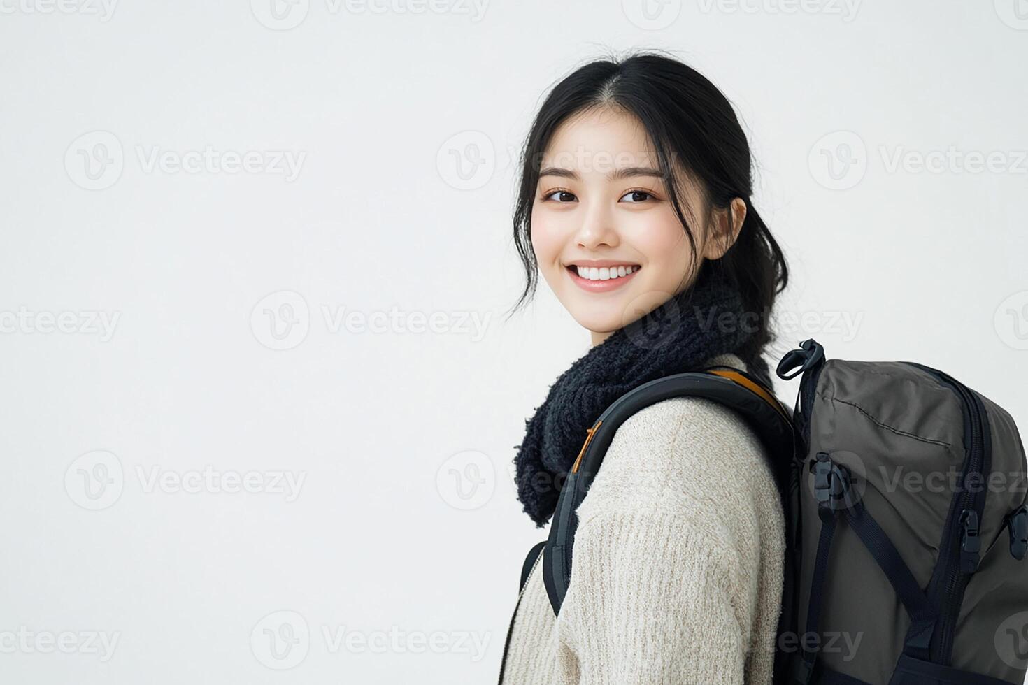 Asian woman with backpack smiling photo