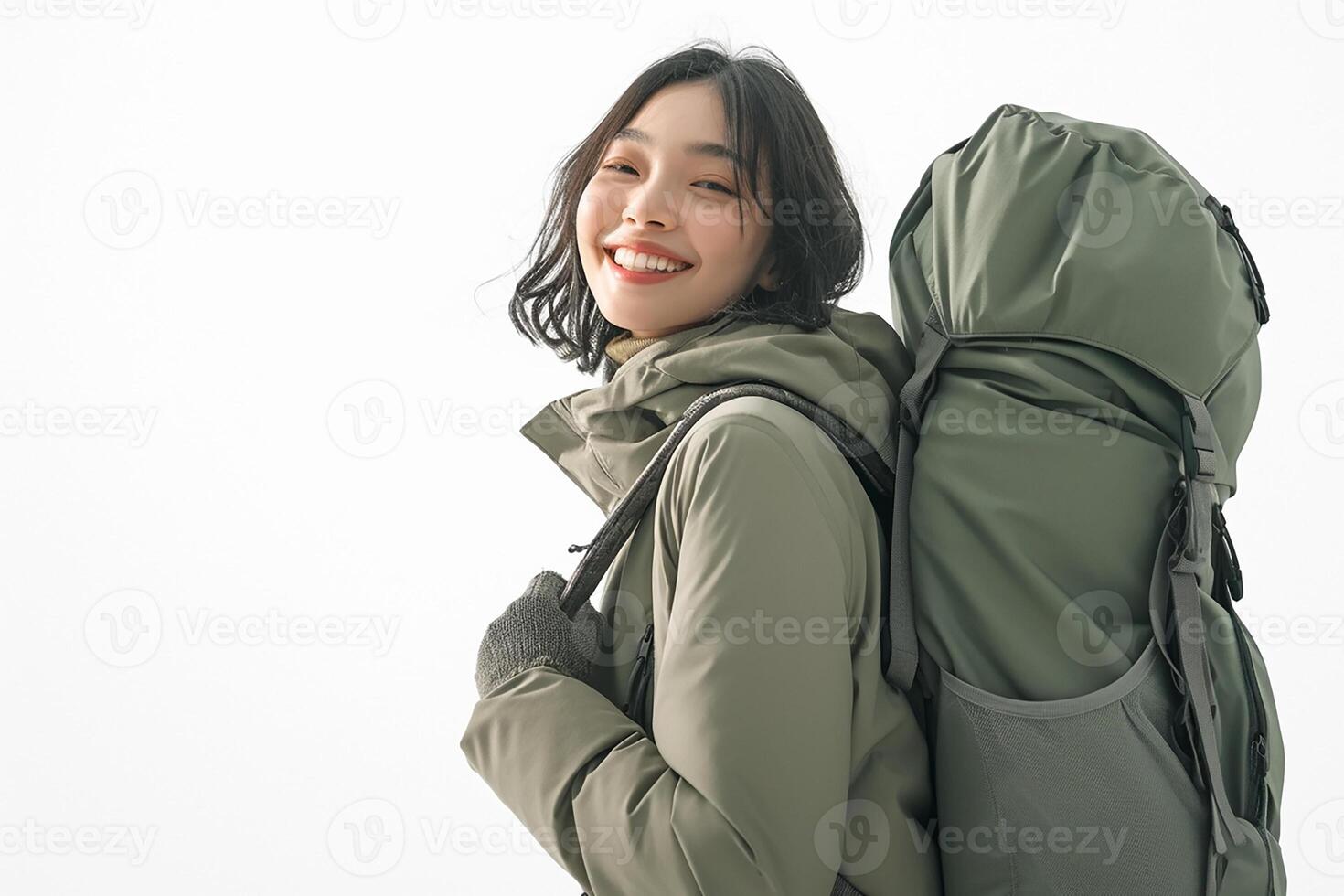 A woman is smiling with a backpack on her back photo