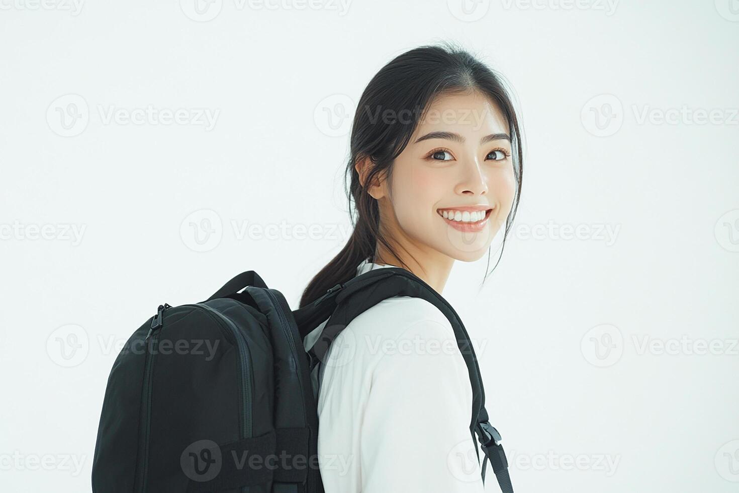 A woman with a backpack smiling photo