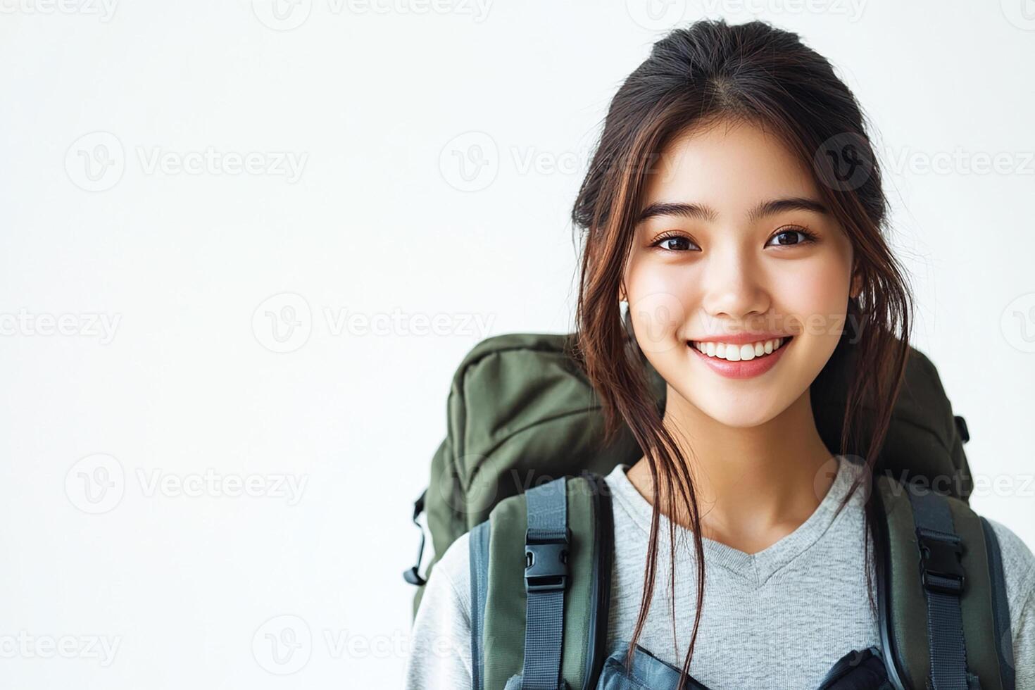 Asian woman with backpack smiling photo