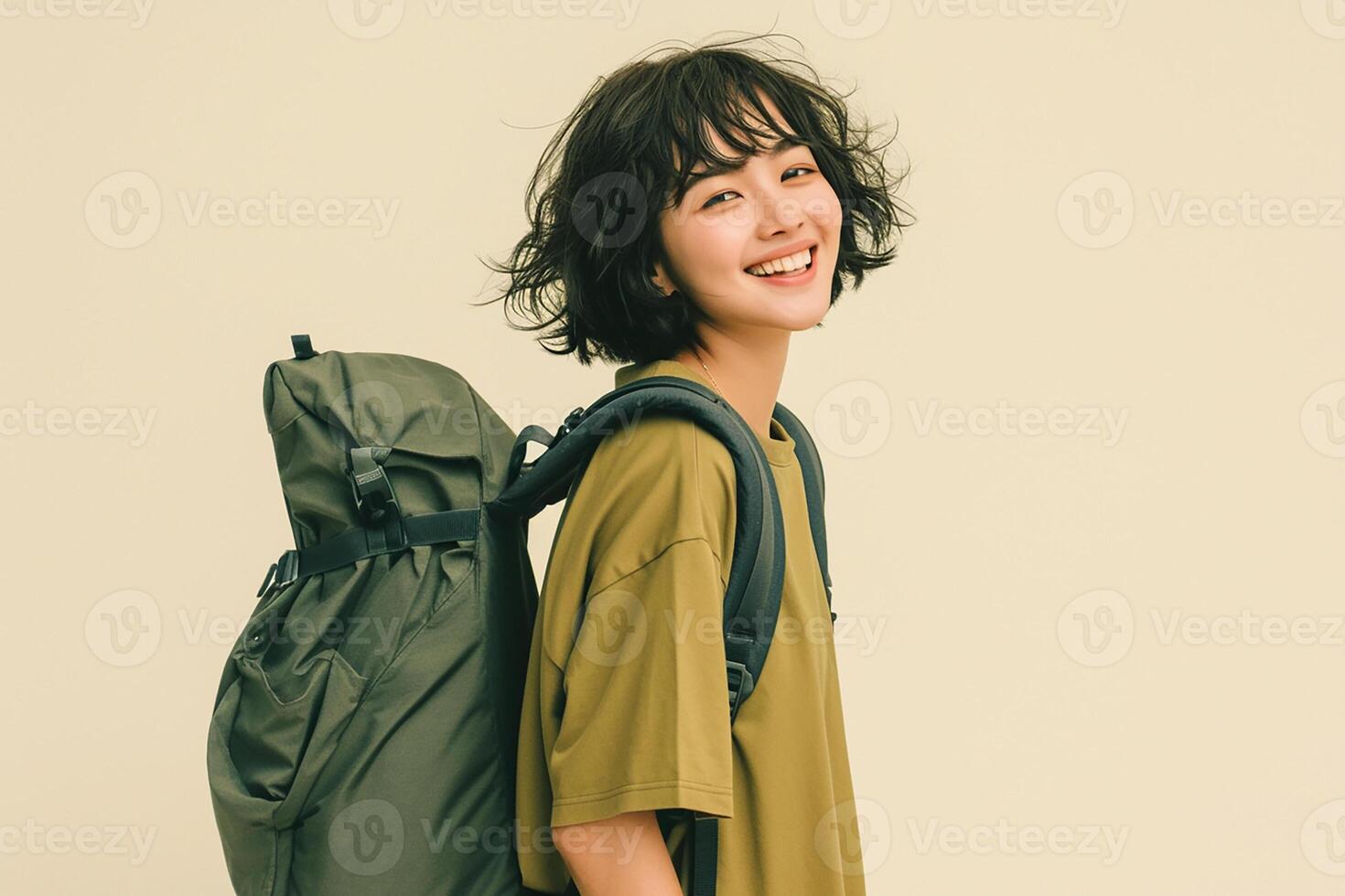Portrait of asian woman with backpack on beige background photo