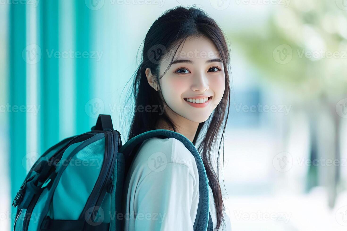 Asian girl with backpack smiling photo