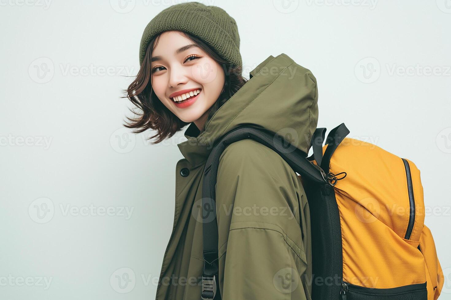 Portrait of asian woman with backpack and hat photo