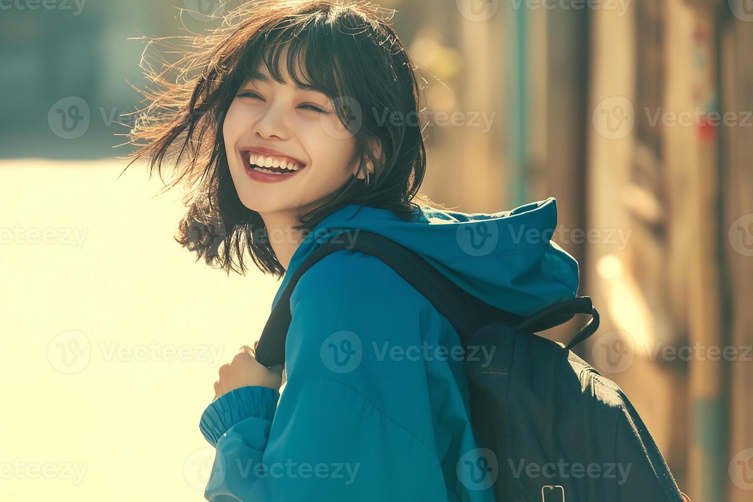 A woman with a backpack smiling photo